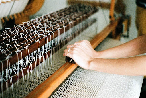 Hands doing weaving process